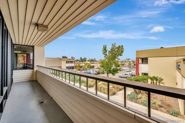 a view of a living room with wooden floor