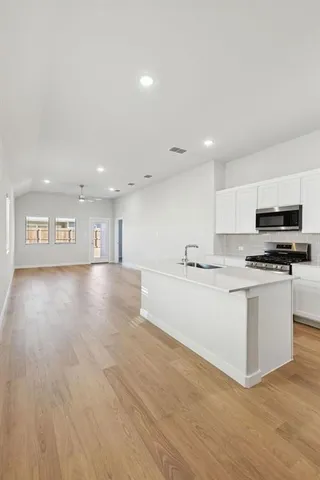 a view of a house with backyard and garden