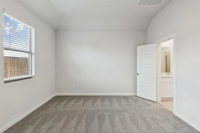 a view of a kitchen with a sink and a refrigerator