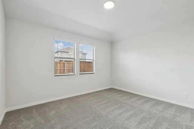a bathroom with a shower sink and mirror
