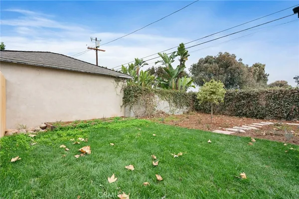 a backyard of a house with lots of green space