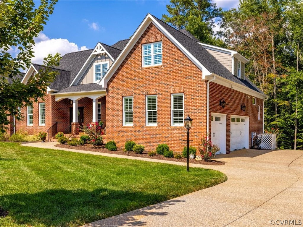 13536 Kelham Road Midlothian, VA 23113 - Photo 2 of 49 a front view of a house with a yard and garage