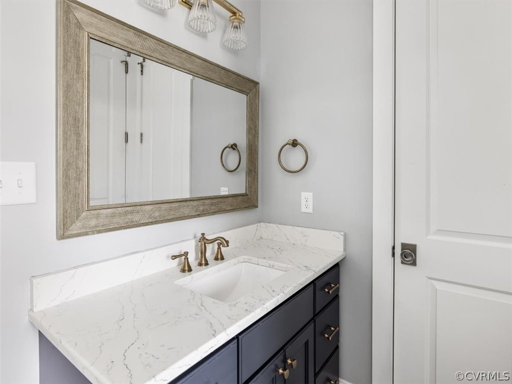13536 Kelham Road Midlothian, VA 23113 - Photo 24 of 49 a bathroom with a sink vanity and a mirror