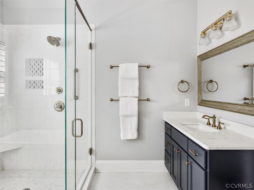 13536 Kelham Road Midlothian, VA 23113 - Photo 25 of 49 a bathroom with a shower sink and mirror