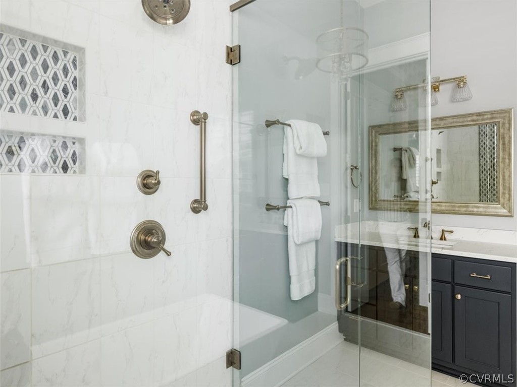 13536 Kelham Road Midlothian, VA 23113 - Photo 26 of 49 a bathroom with a tub sink mirror and shower