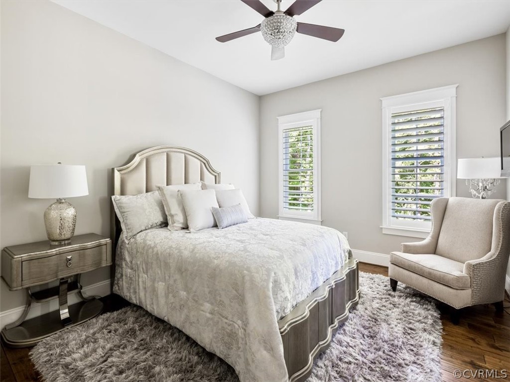 13536 Kelham Road Midlothian, VA 23113 - Photo 28 of 49 a spacious bedroom with a bed a couch and a window