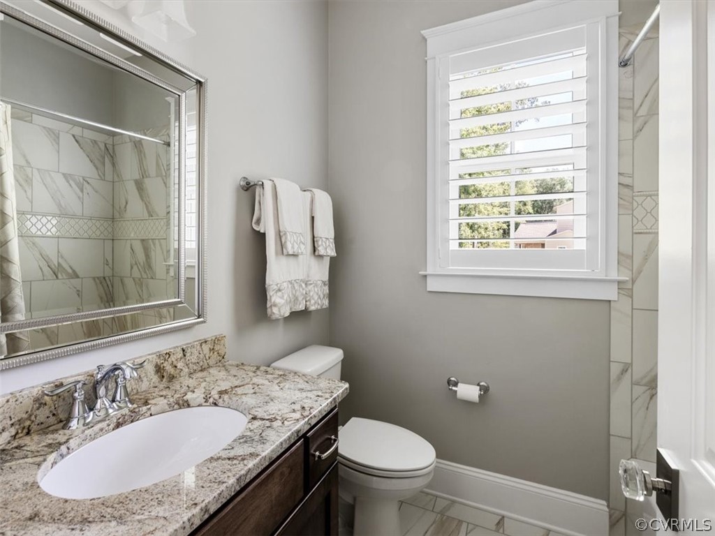13536 Kelham Road Midlothian, VA 23113 - Photo 29 of 49 a bathroom with a granite countertop sink toilet and mirror