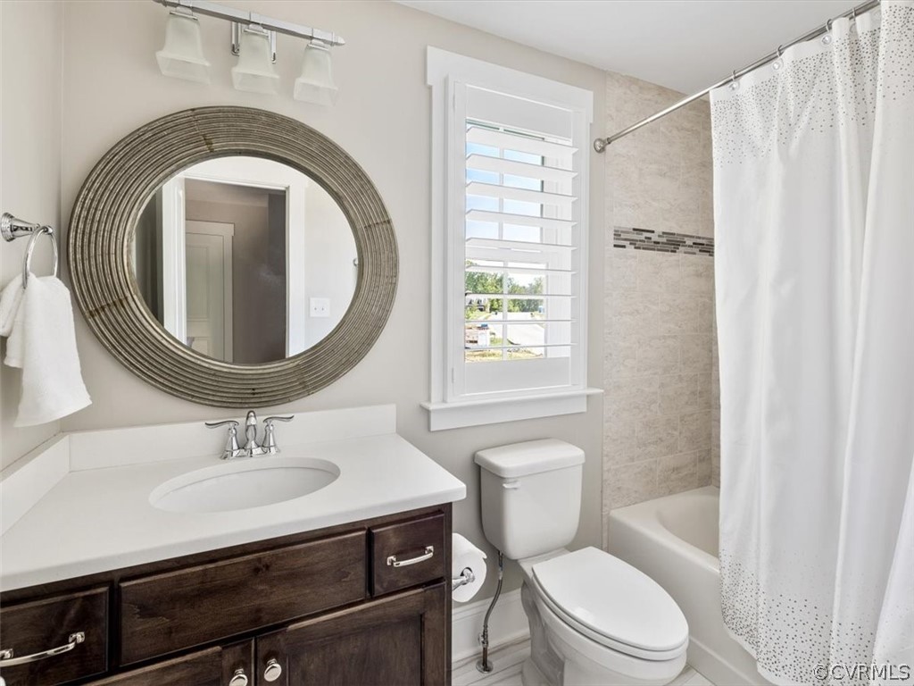 13536 Kelham Road Midlothian, VA 23113 - Photo 31 of 49 a bathroom with a sink a toilet and a mirror