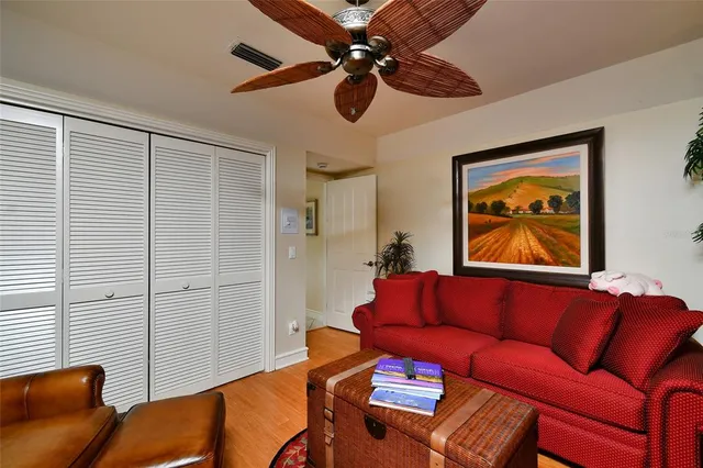 a dining room with furniture a chandelier and window