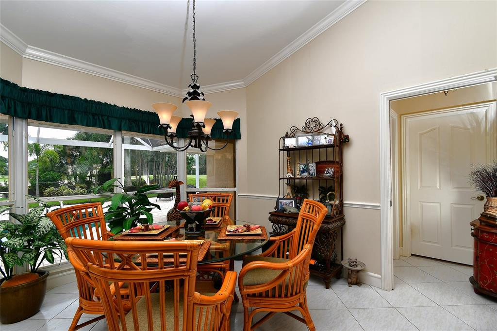 6030 Key Largo Circle Punta Gorda, FL 33955 - Photo 26 of 44 a dining room with furniture a chandelier and window