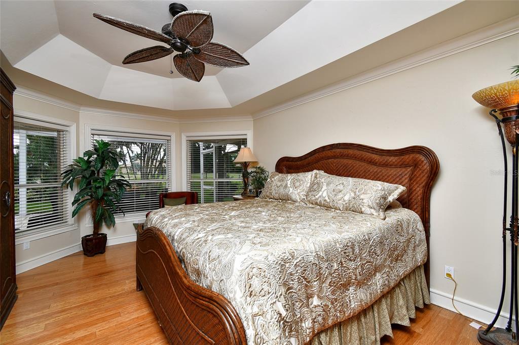 6030 Key Largo Circle Punta Gorda, FL 33955 - Photo 28 of 44 a bedroom with a bed lamps and table