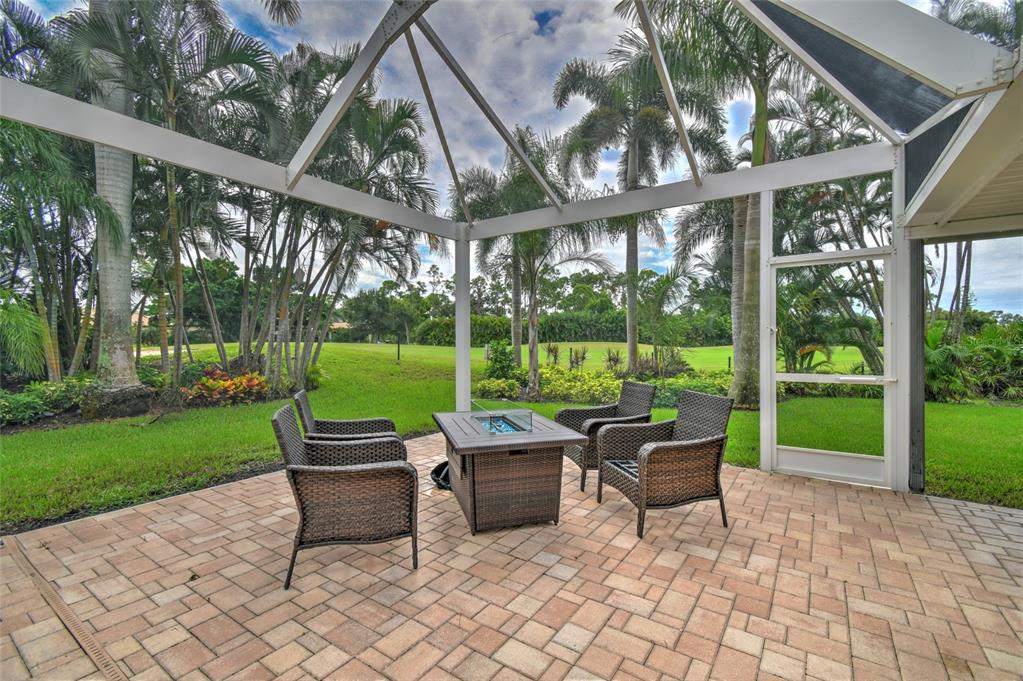6030 Key Largo Circle Punta Gorda, FL 33955 - Photo 38 of 44 a backyard of a house with garden and outdoor seating