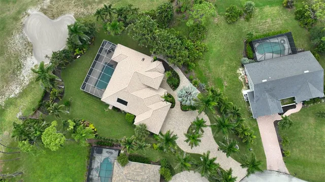 an aerial view of a house with outdoor space and street view