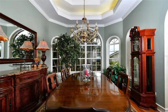 a lobby with furniture and a chandelier