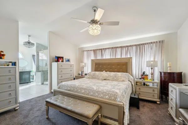 a bedroom with a bed and a table