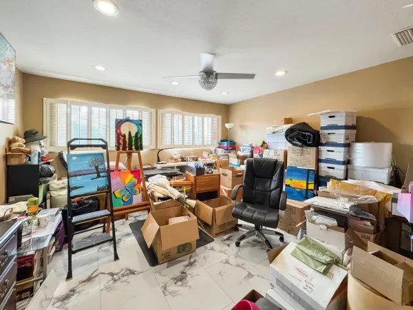 a living room with lots of furniture and a wooden floor