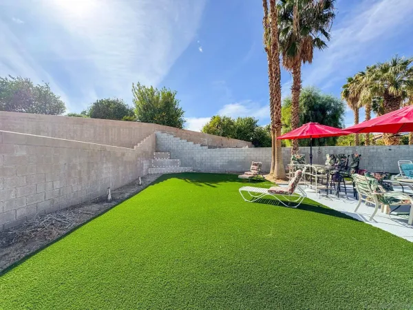 an outdoor sitting area with golf course