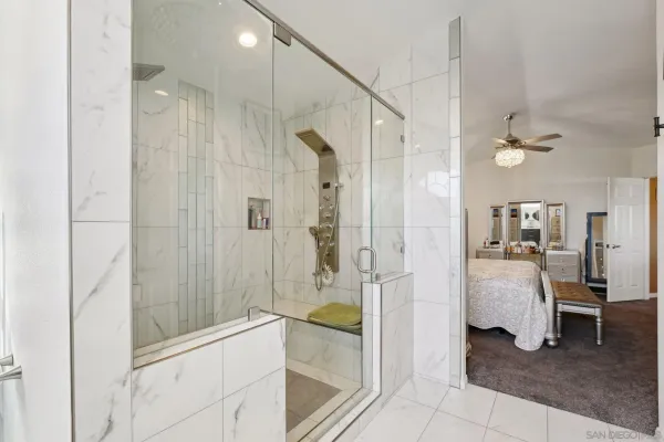 a bathroom with a bathtub and a shower