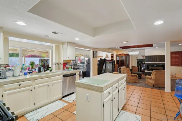 a view of kitchen with sink and living room