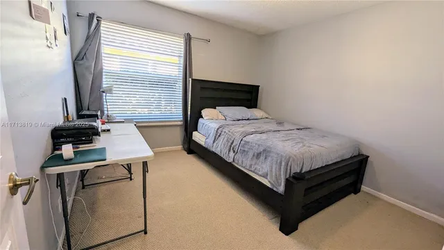 a bedroom with a bed and furniture