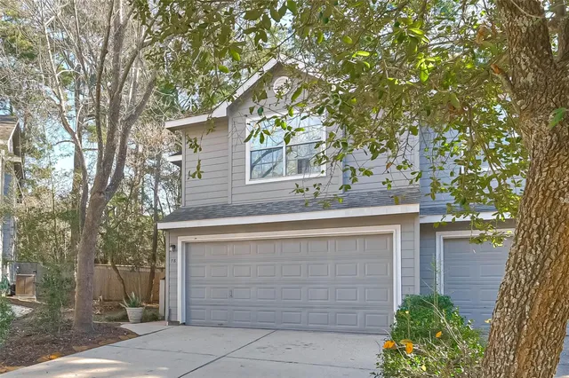 front view of a house with a tree