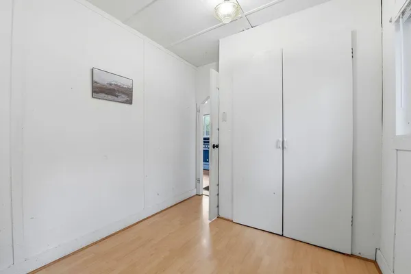 an empty room with an entryway door