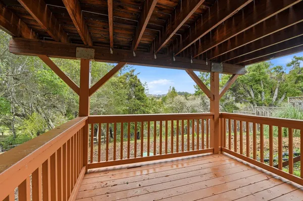 a view of porch with wooden floor in outdoor space
