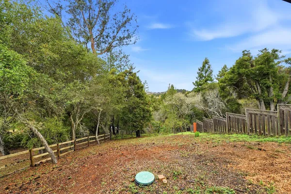 a backyard of a house with lots of green space