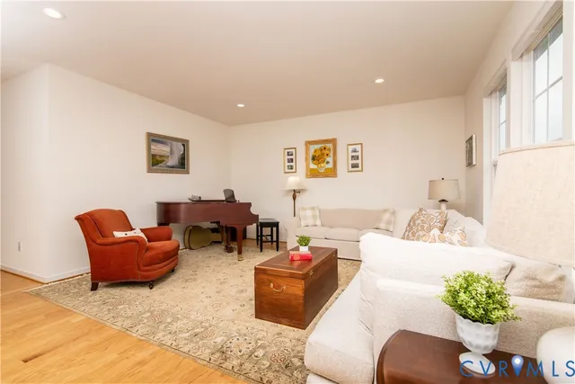 a living room with furniture flowerpot and a window