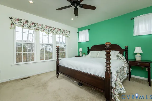 a bed sitting in a room next to a window