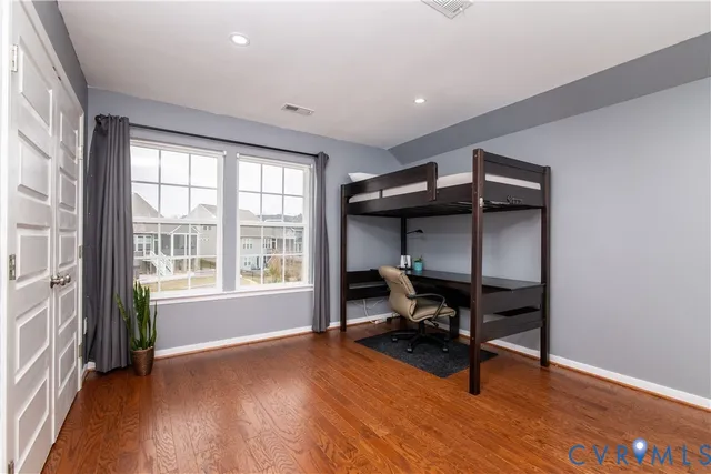 a bedroom with furniture and a window