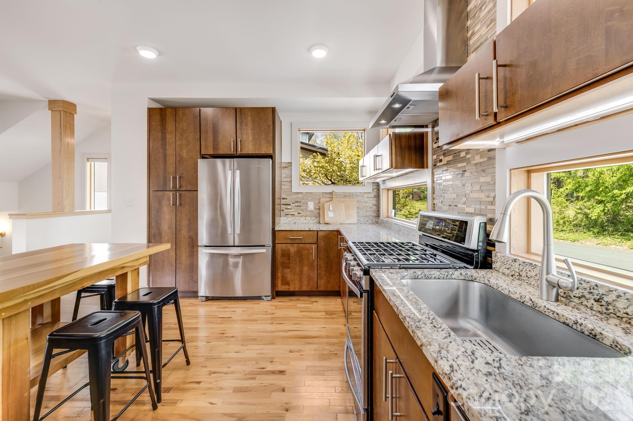 14 Sulphur Springs Road Asheville, NC 28806 - Photo 11 of 29 a kitchen with a sink cabinets and refrigerator