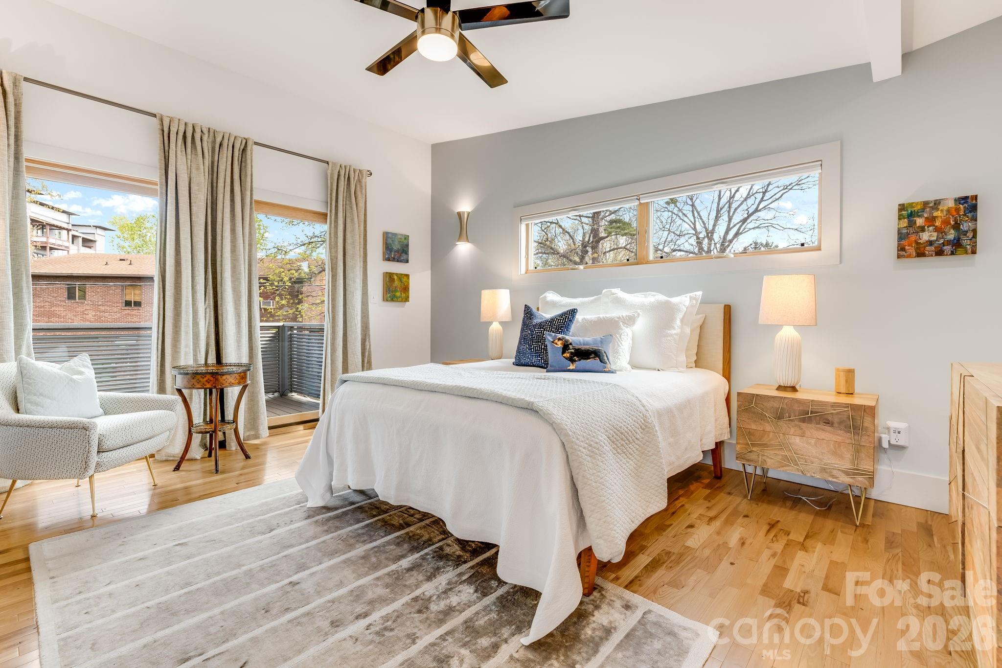 14 Sulphur Springs Road Asheville, NC 28806 - Photo 14 of 29 a bedroom with a large bed and a chandelier