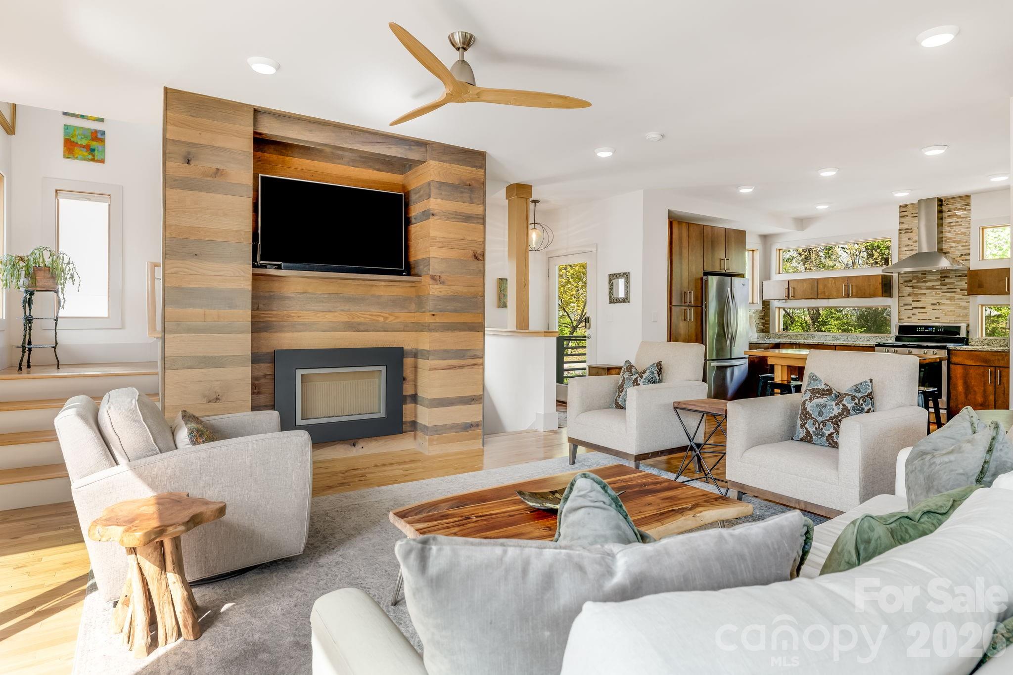 14 Sulphur Springs Road Asheville, NC 28806 - Photo 5 of 29 a living room with furniture fireplace and a flat screen tv