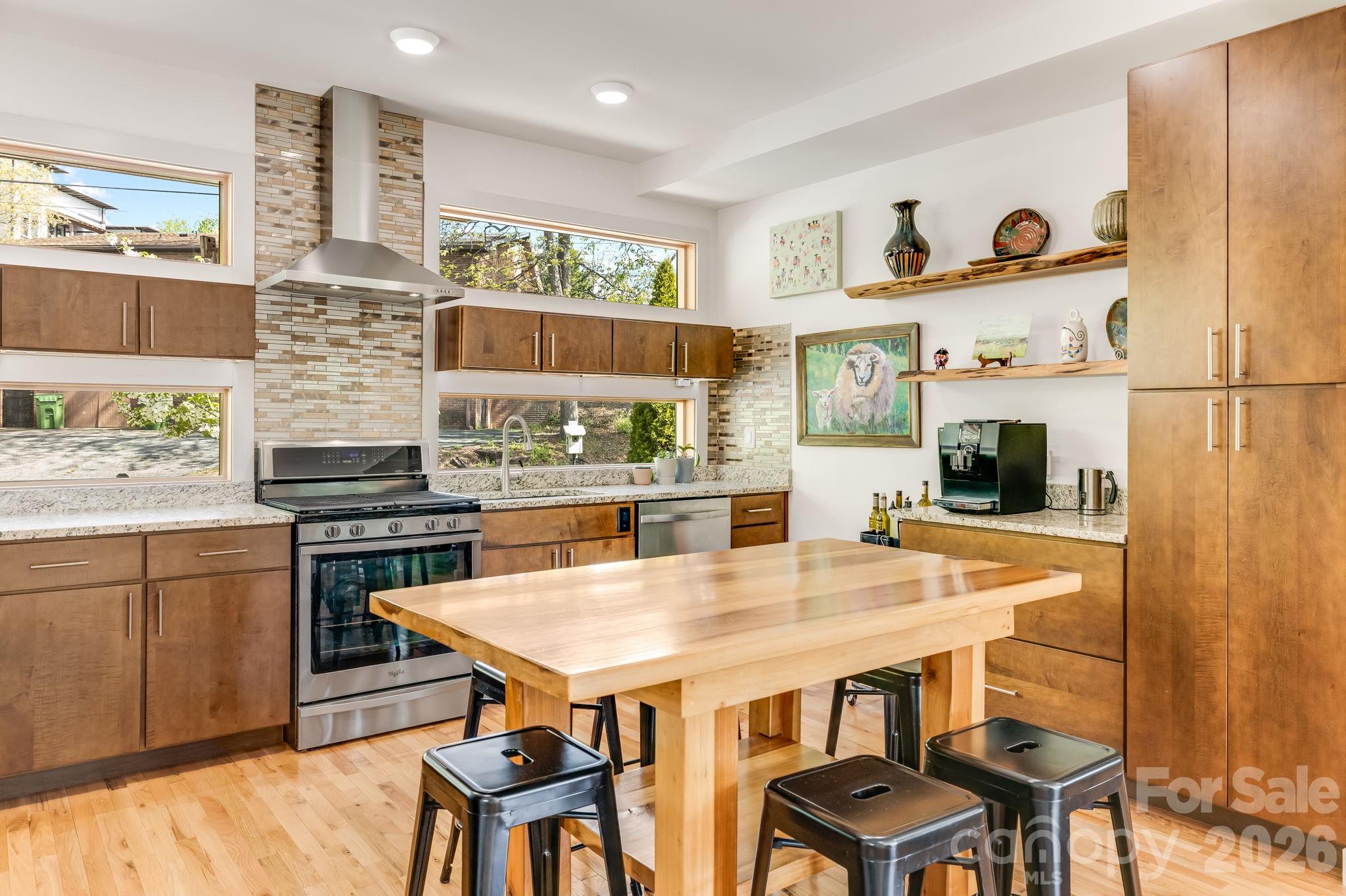 14 Sulphur Springs Road Asheville, NC 28806 - Photo 9 of 29 a kitchen with stainless steel appliances granite countertop a stove and a refrigerator
