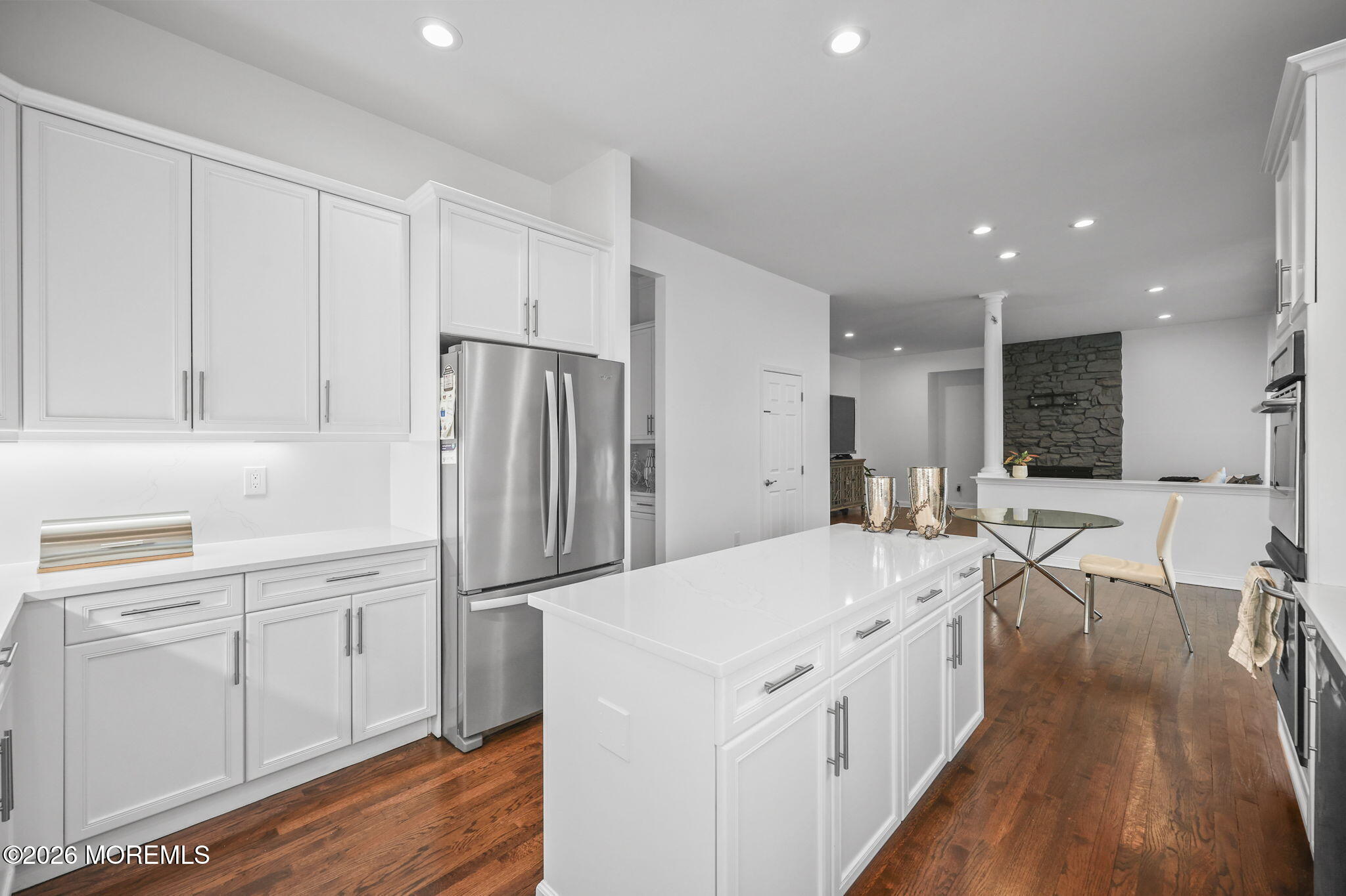 29 Chad Lane Howell, NJ 07731 - Photo 15 of 44 a kitchen with white cabinets and stainless steel appliances