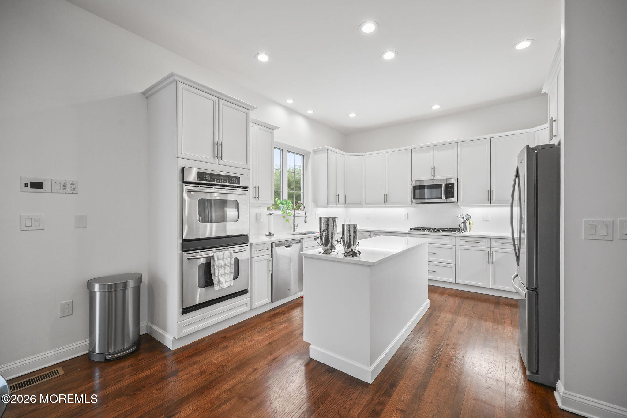 29 Chad Lane Howell, NJ 07731 - Photo 16 of 44 a kitchen with white cabinets and stainless steel appliances