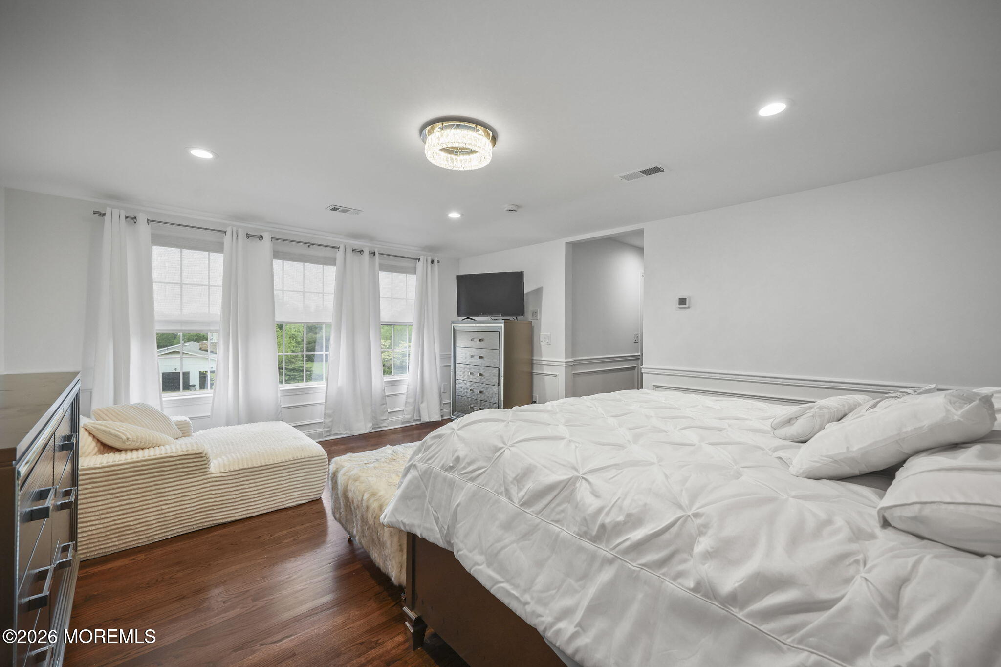 29 Chad Lane Howell, NJ 07731 - Photo 24 of 44 a spacious bedroom with a bed and a large window