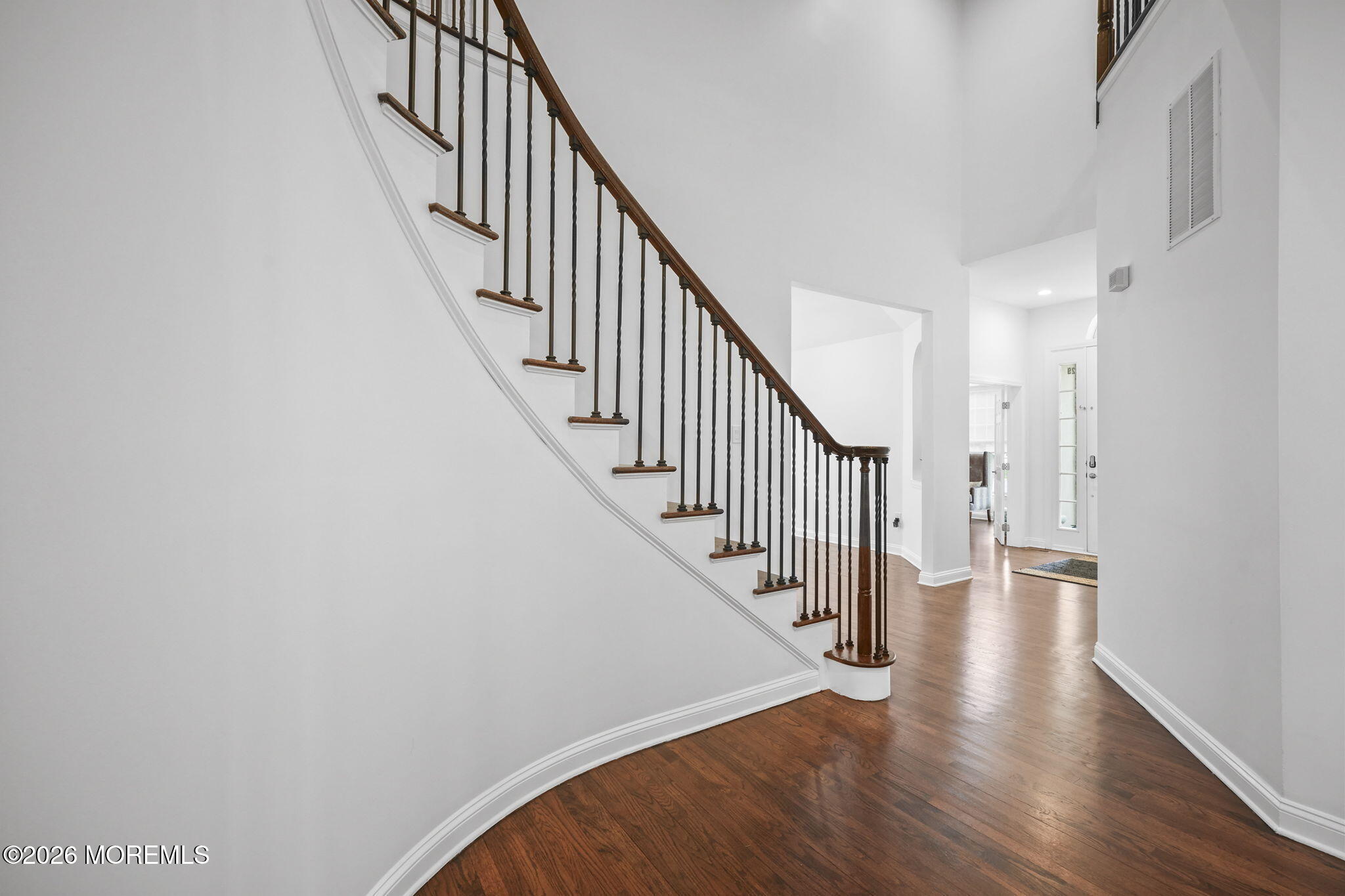29 Chad Lane Howell, NJ 07731 - Photo 3 of 44 a view of staircase with wooden floor and white walls