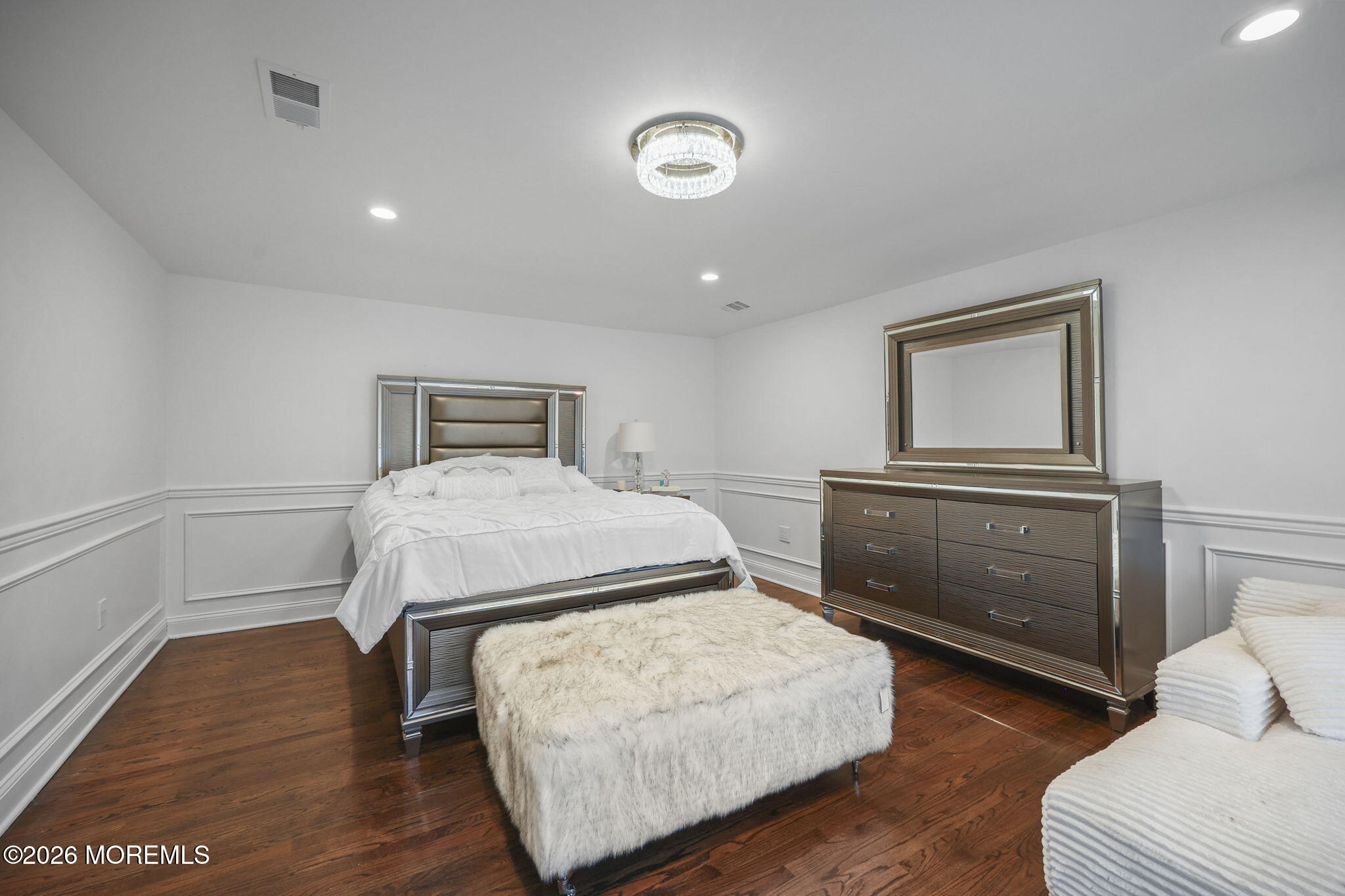 29 Chad Lane Howell, NJ 07731 - Photo 31 of 44 a bedroom with a bed and a dresser