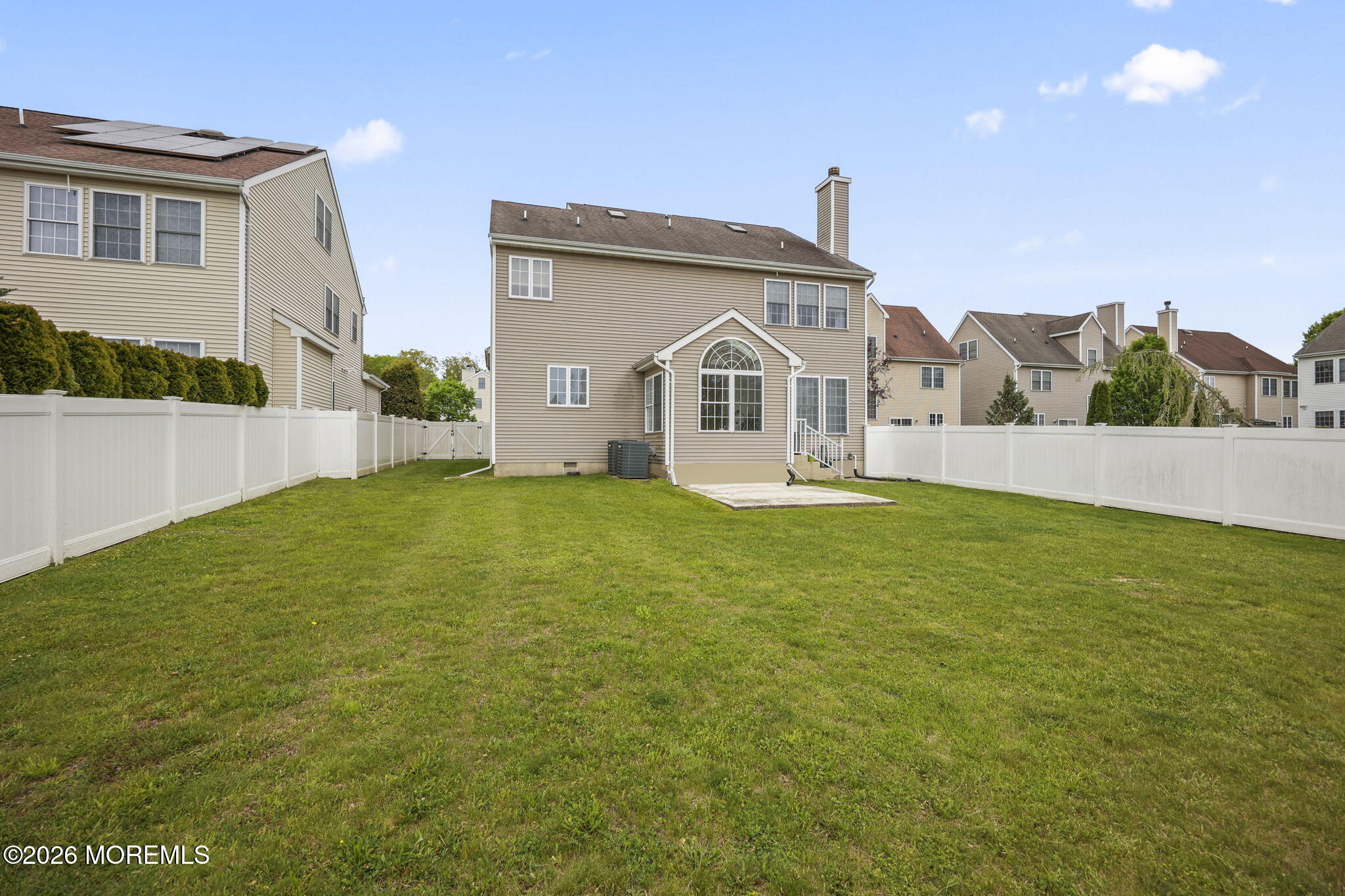 29 Chad Lane Howell, NJ 07731 - Photo 40 of 44 a front view of a house with a yard and potted plants