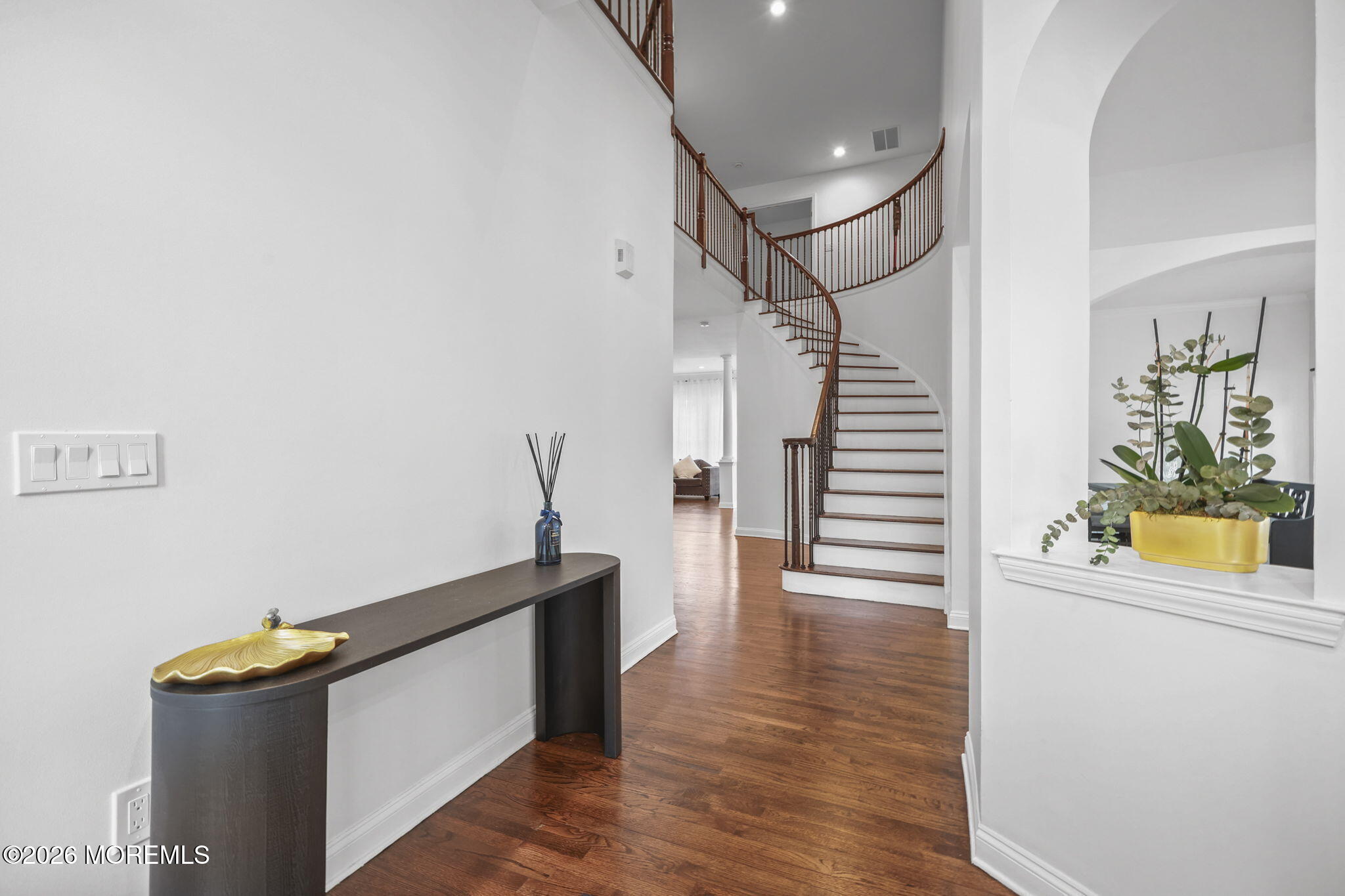 29 Chad Lane Howell, NJ 07731 - Photo 5 of 44 a view of a hallway with wooden floor and entryway