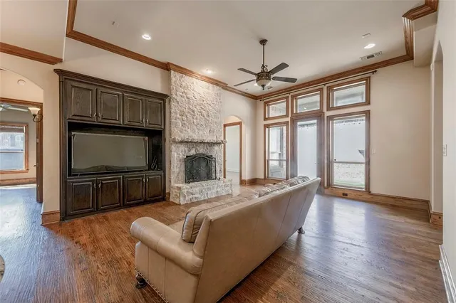 a living room with furniture fireplace and flat screen tv