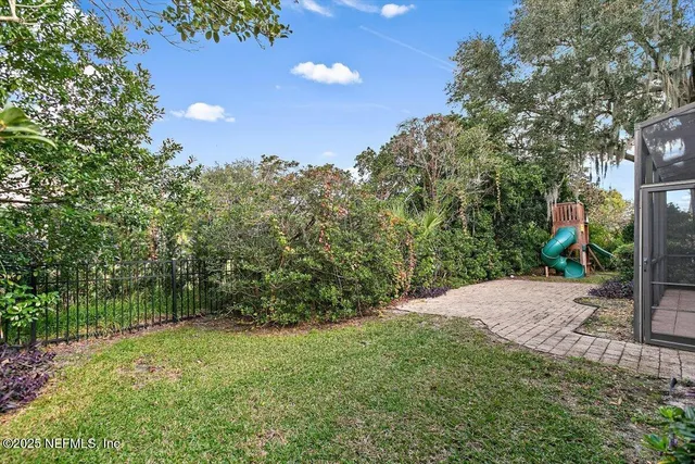 a bathroom with a tub a sink and a mirror