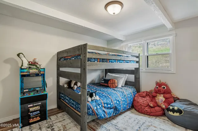 a bedroom with bed and a window