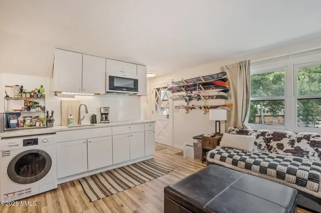 a kitchen with sink cabinets and window