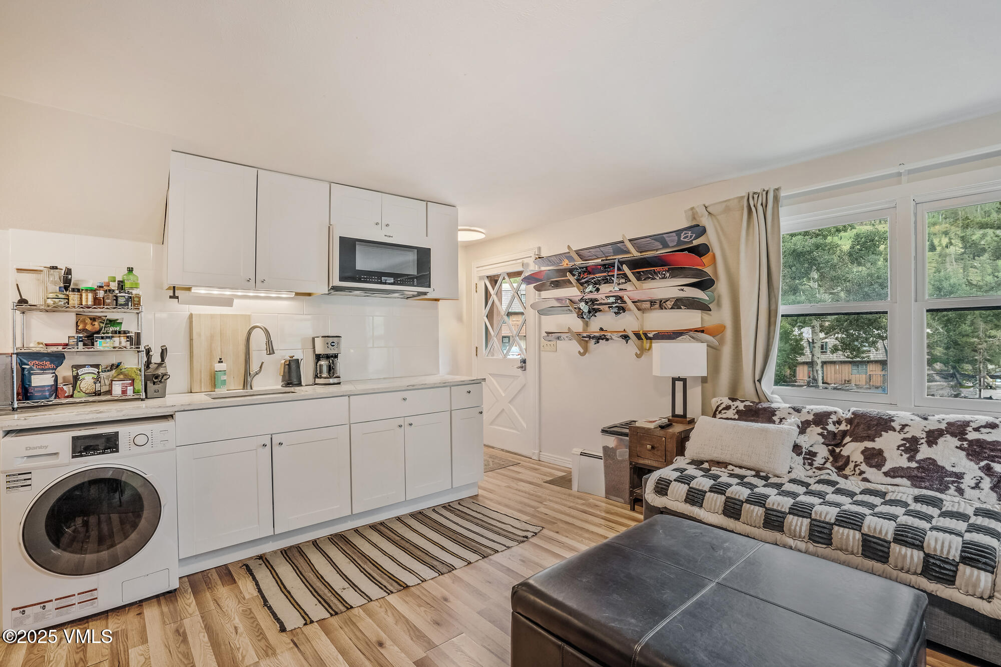 2487 Chamonix Lane, Unit F1 Vail, CO 81657 - Photo 12 of 27 a kitchen with sink cabinets and window