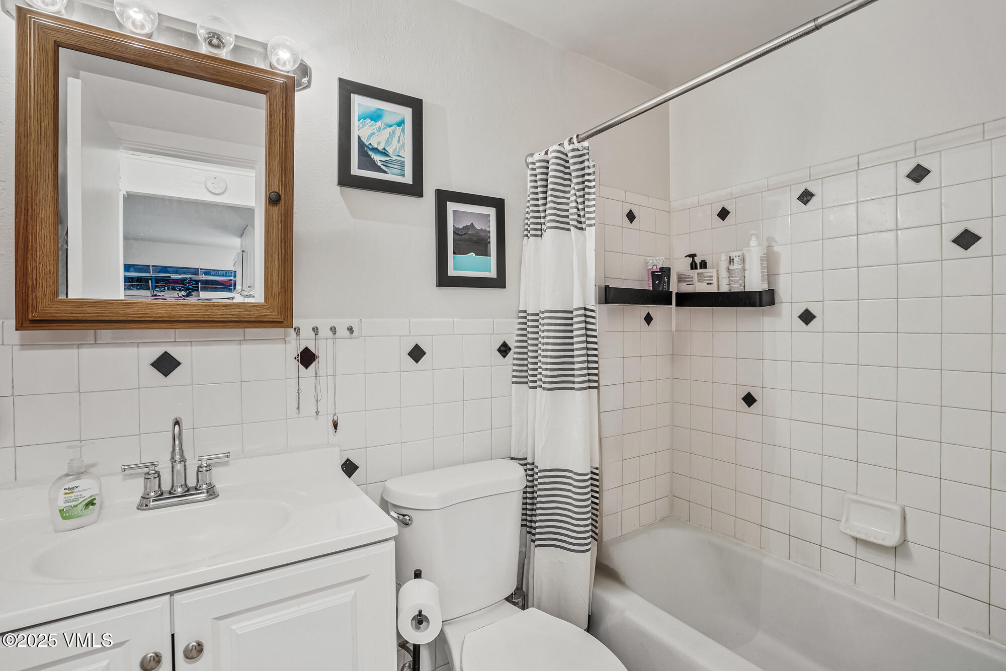 2487 Chamonix Lane, Unit F1 Vail, CO 81657 - Photo 16 of 27 a bathroom with a sink toilet and shower