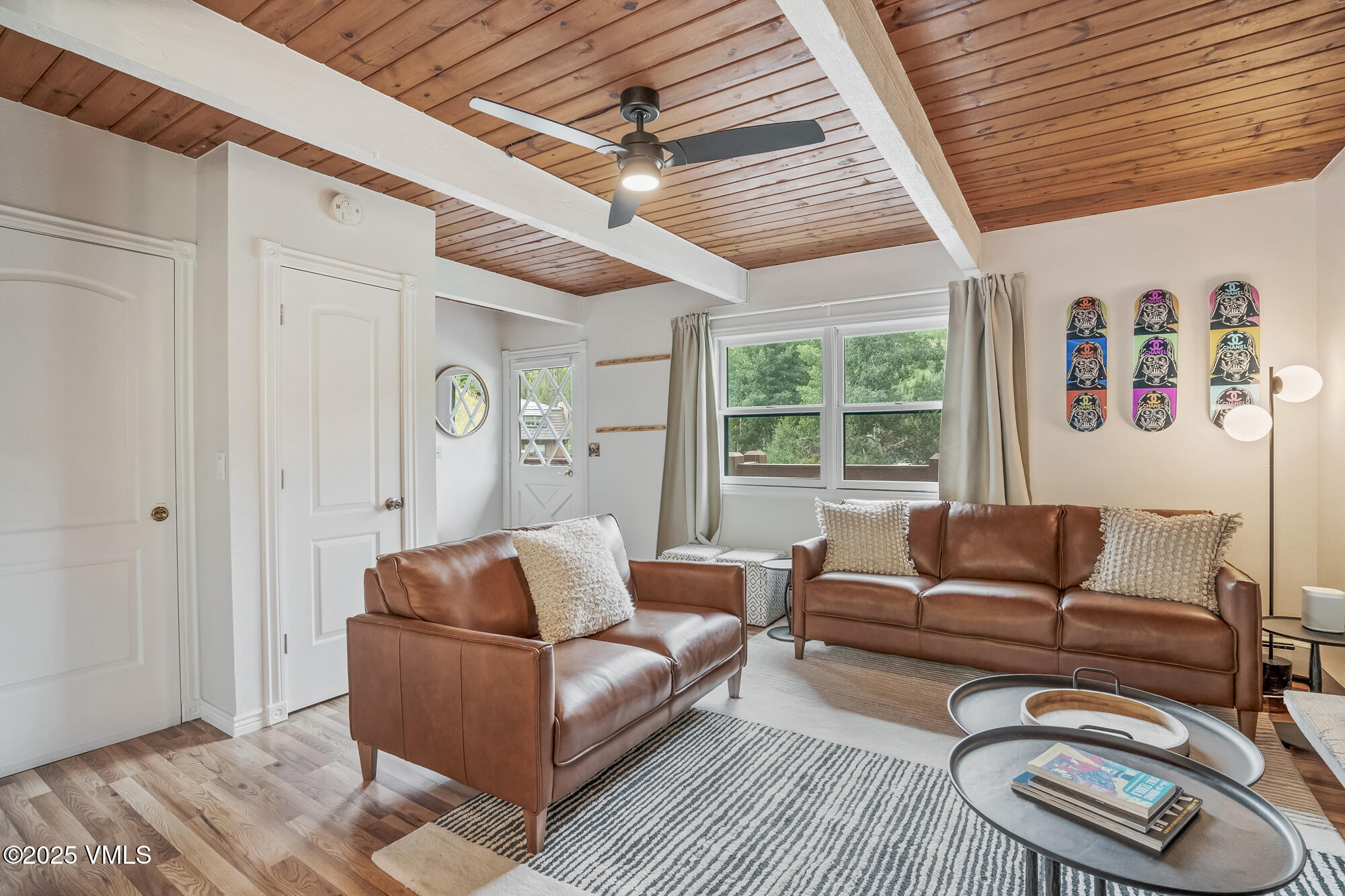 2487 Chamonix Lane, Unit F1 Vail, CO 81657 - Photo 2 of 27 a living room with furniture and a large window