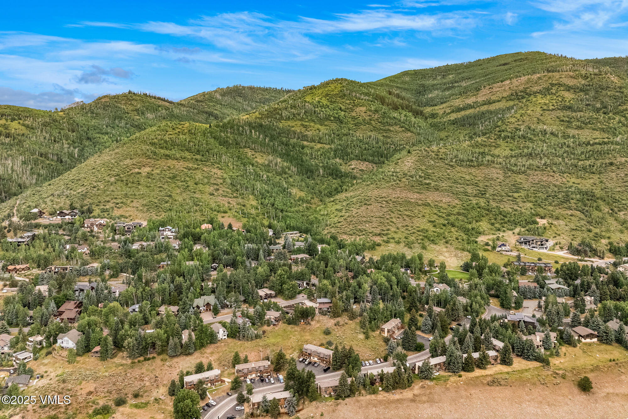 2487 Chamonix Lane, Unit F1 Vail, CO 81657 - Photo 25 of 27 a view of a mountain range in a cloudy sky